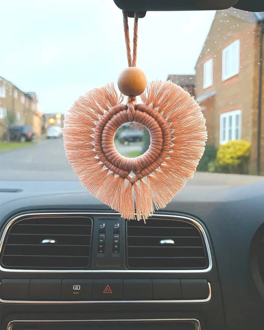 Boho macramé heart car charm hanging in car interior