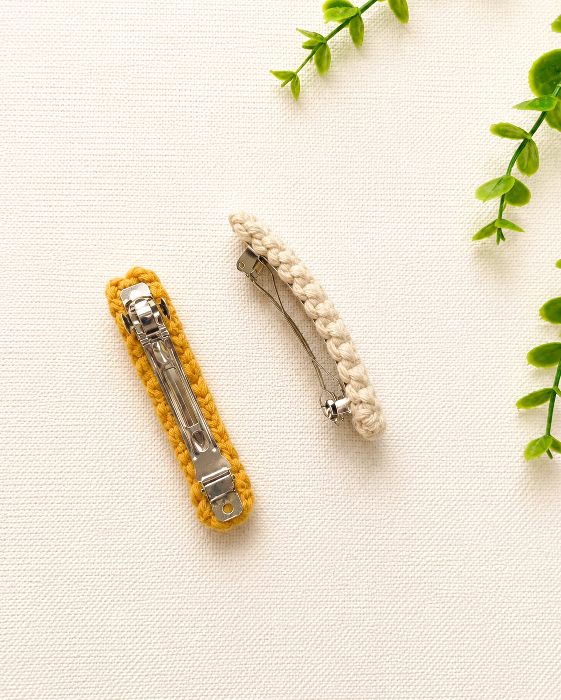 Back view of macramé hair clips showing the metal clip fastening