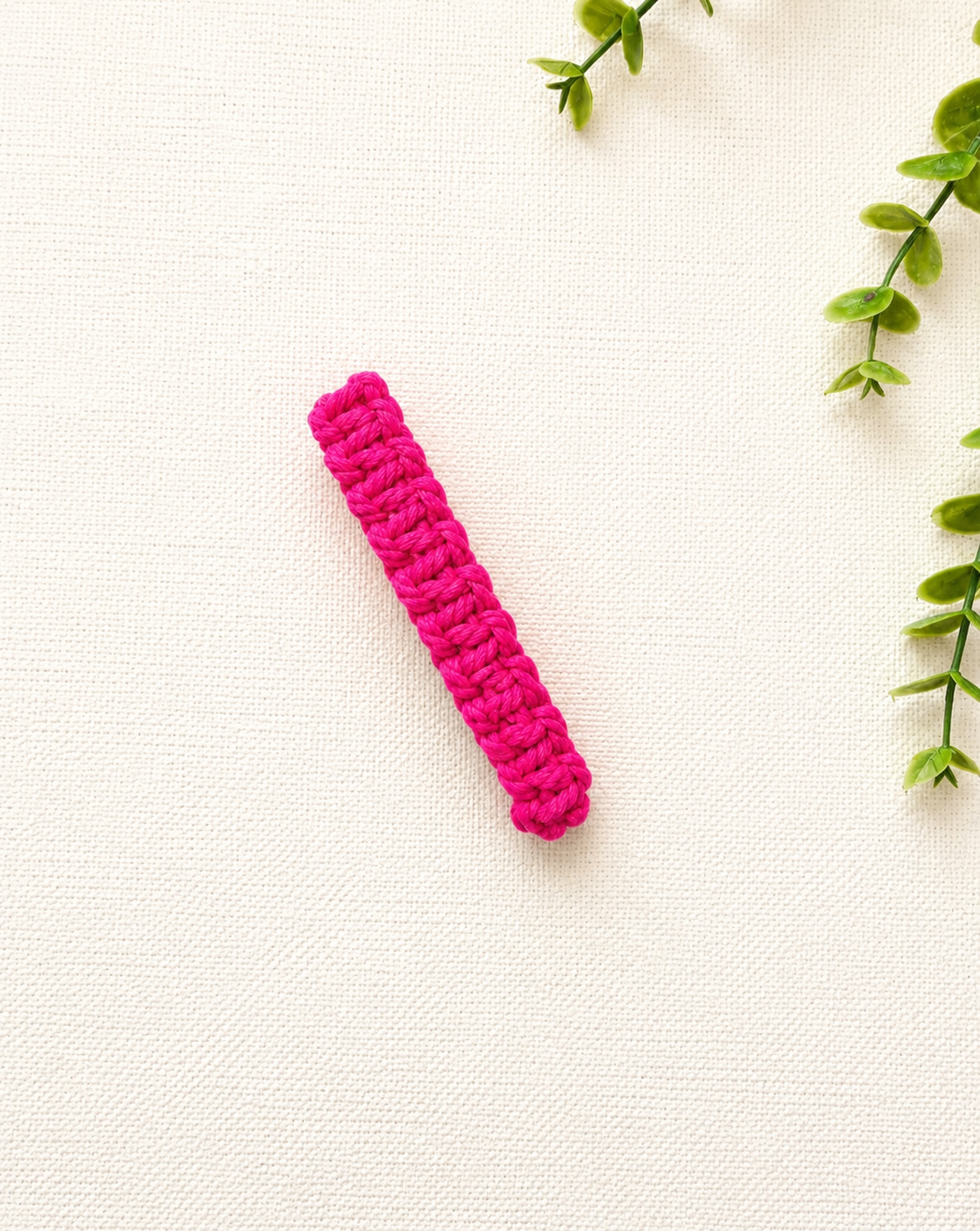 Fuchsia pink handmade macramé hair clip with boho woven design