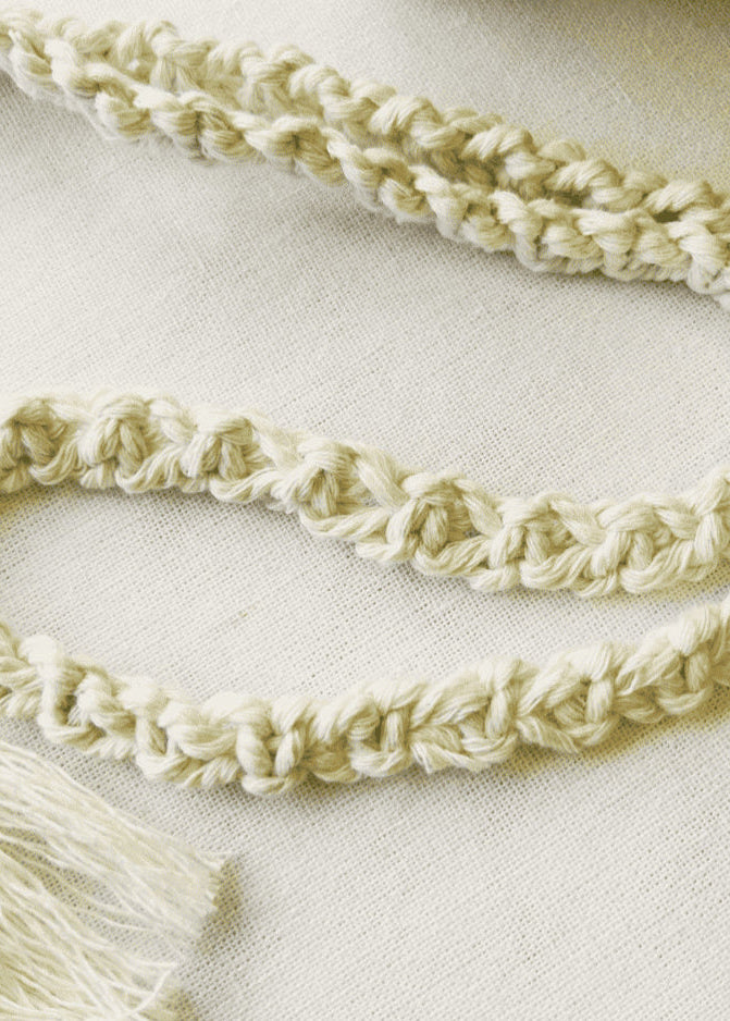 Close-up of handmade macramé strap – twisted cotton cord for phone bag or mini purse