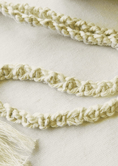 Close-up of handmade macramé strap – twisted cotton cord for phone bag or mini purse