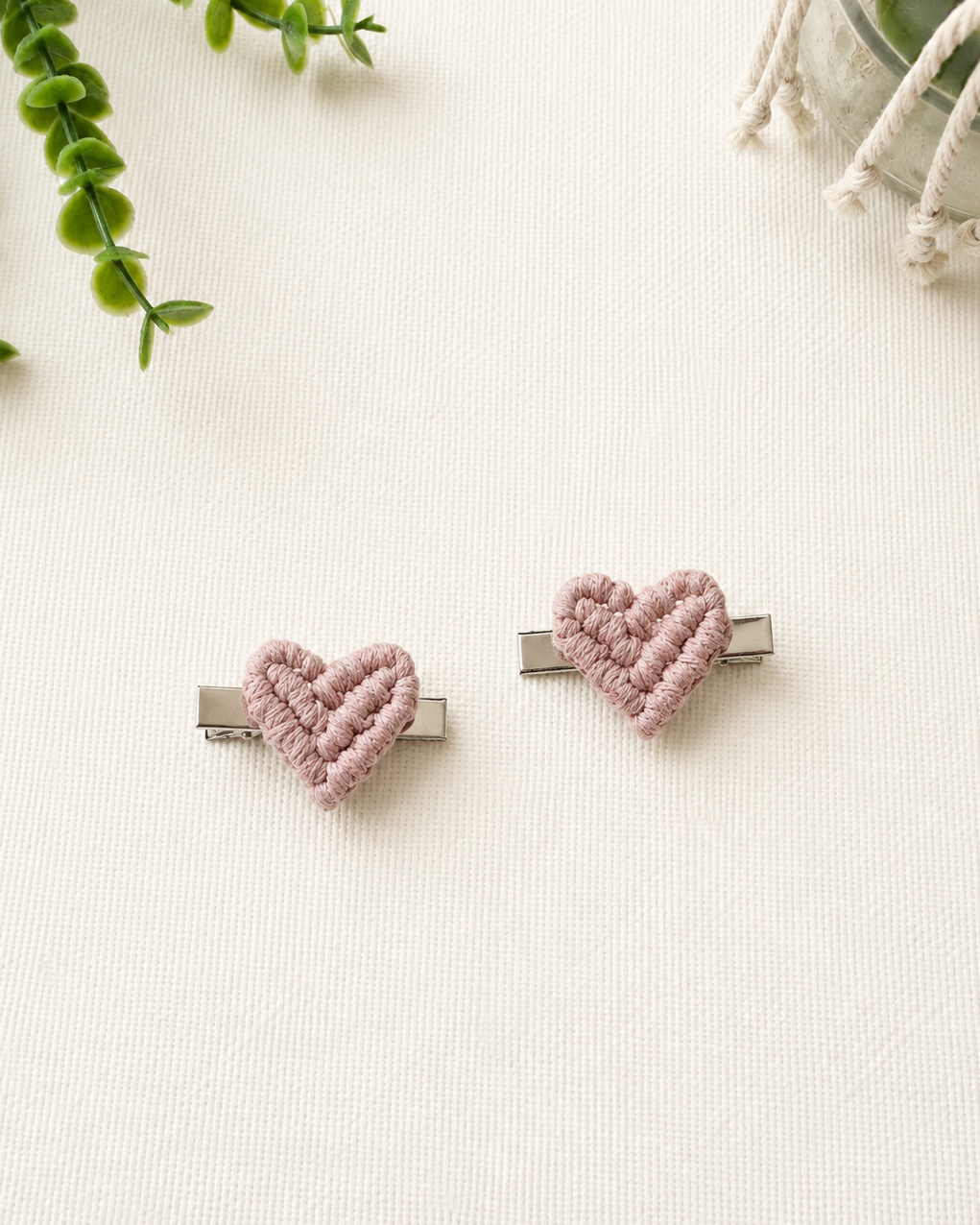 Set of two blush pink handmade macrame heart hair clips.