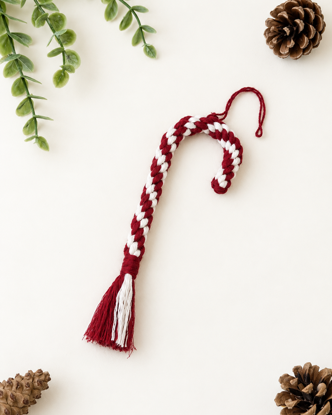Handmade burgundy and cream macrame candy cane Christmas ornament