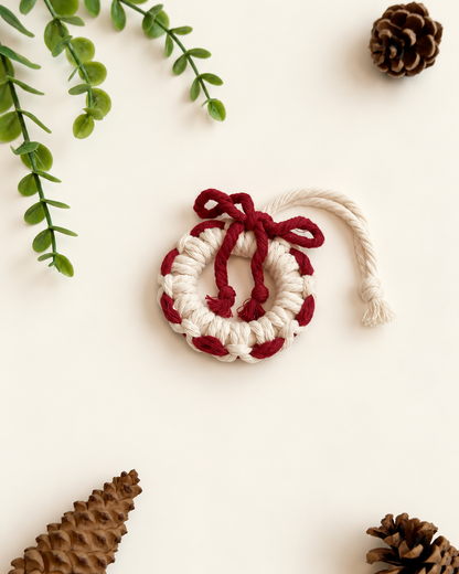 Cream macrame wreath Christmas ornament with burgundy woven detail and bow