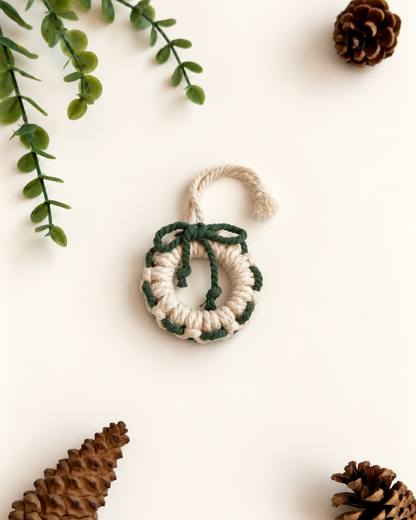 Cream macrame Christmas wreath ornament with green bow and woven detail