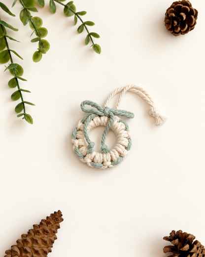 Cream macrame Christmas wreath ornament with sage green bow