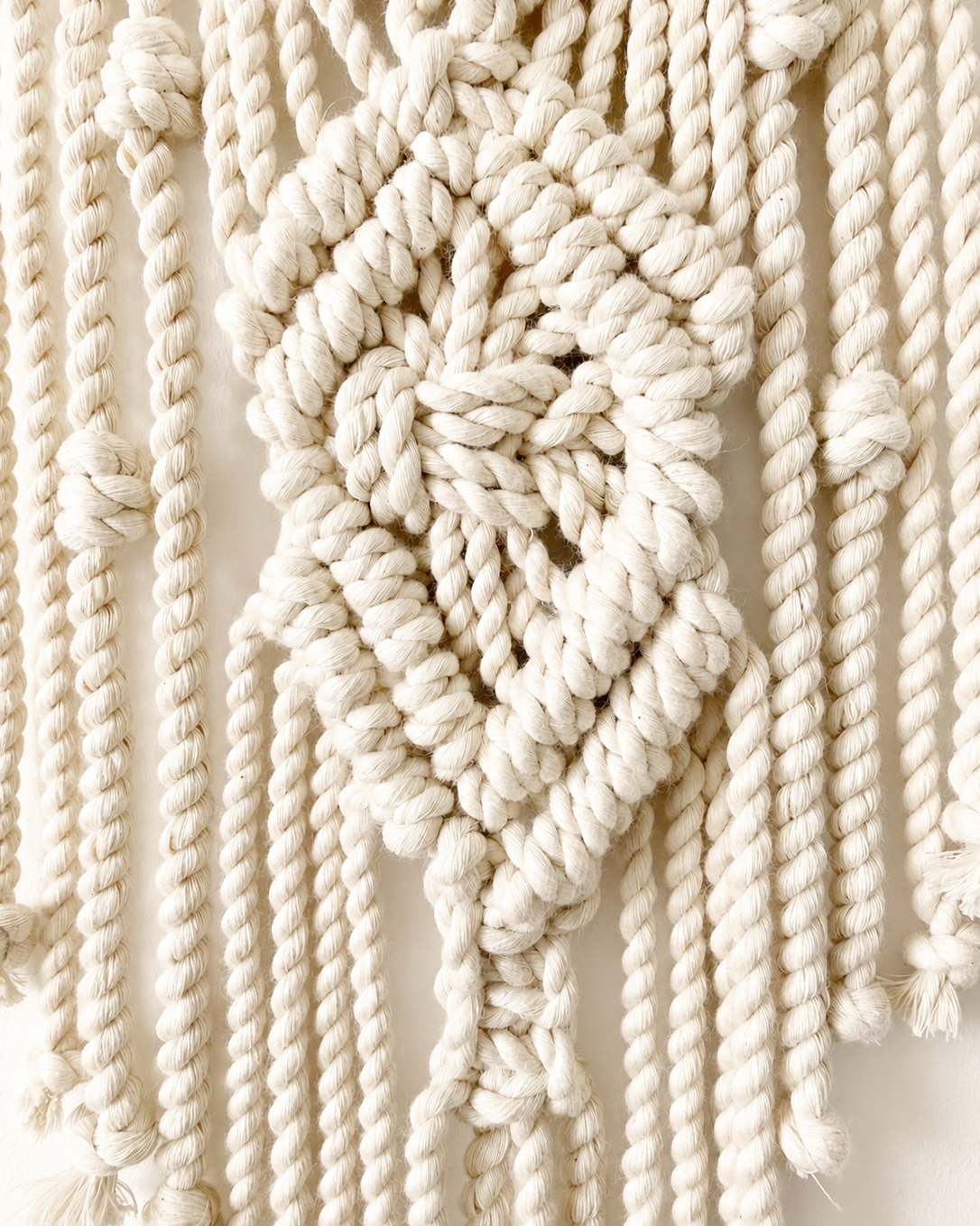 Close-up of textured cotton knots on Diamond macrame star wall hanging