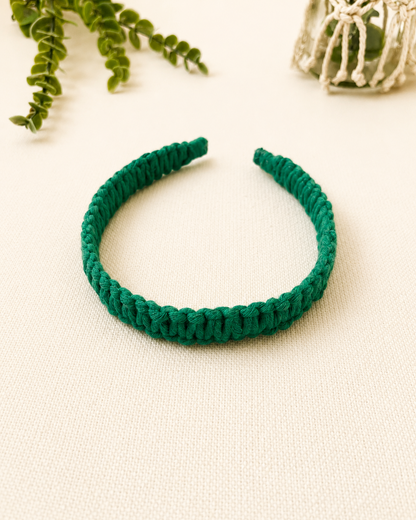Handmade emerald green macrame square knot headband with a textured knot design.