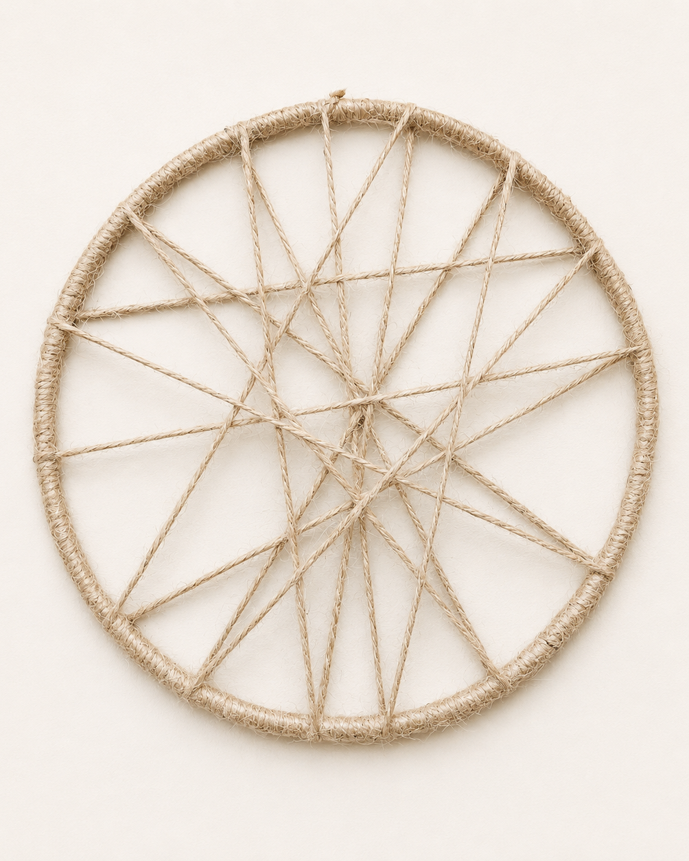 Handmade jute woven open circle wall decor with abstract web design