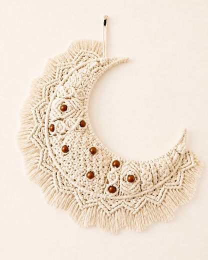 Handmade macrame crescent moon wall hanging in off-white Egyptian cotton with brown wooden beads