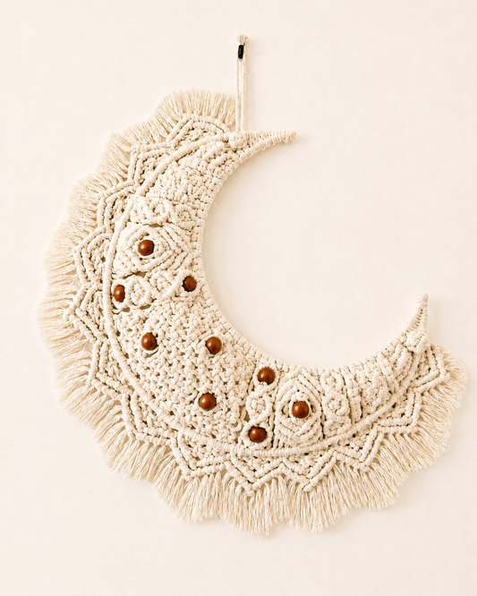 Handmade macrame crescent moon wall hanging in off-white Egyptian cotton with brown wooden beads
