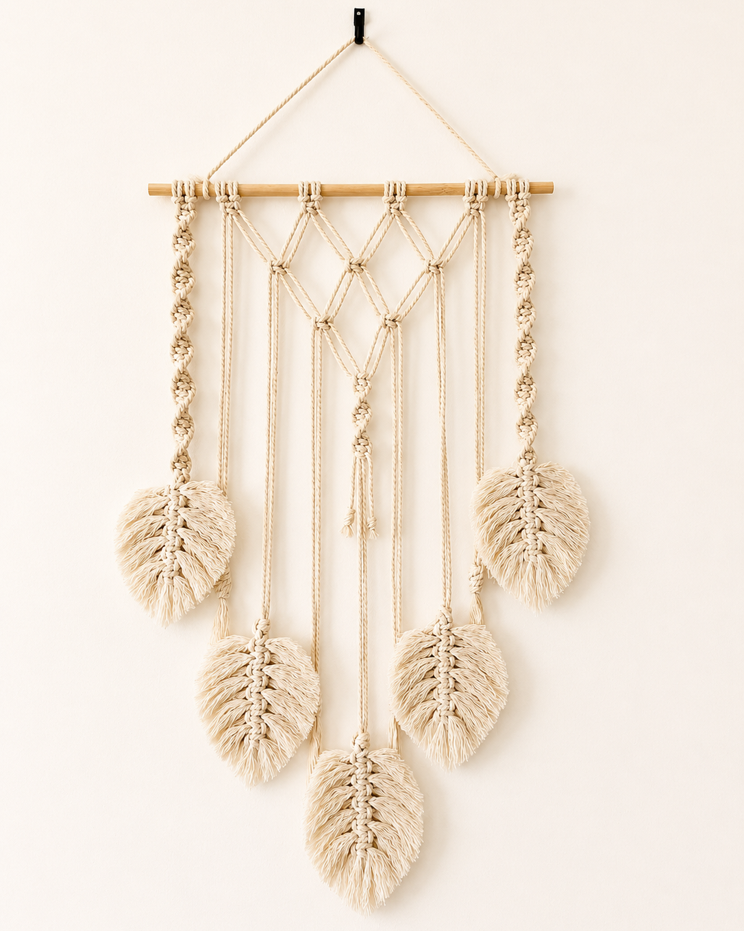 Handmade off-white macrame photo holder wall hanging with five cotton leaves