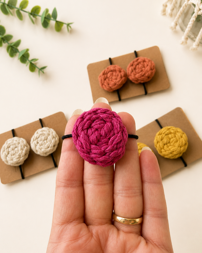 Close-up of a handmade hot pink macrame cotton hair tie.