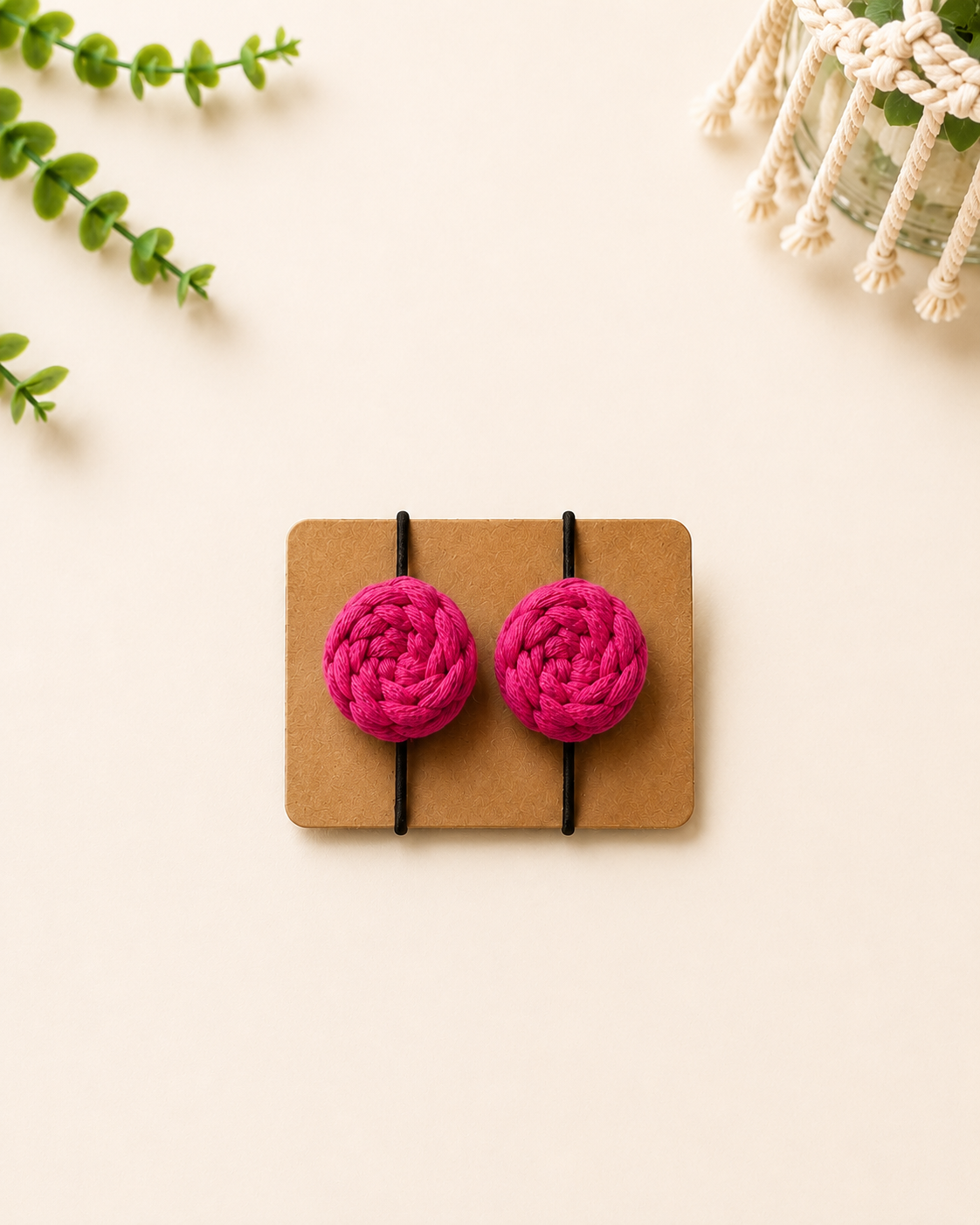 Hot pink handmade macrame cotton hair ties with black elastic bands.