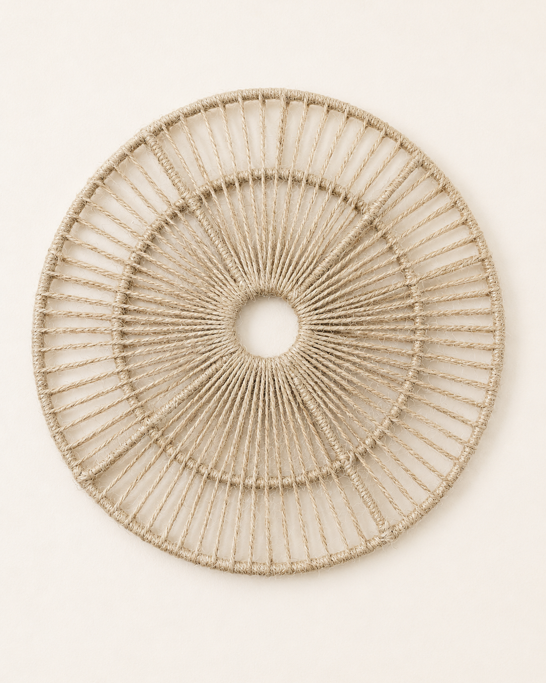 Handmade 30cm jute cord round wall hanging with open woven design