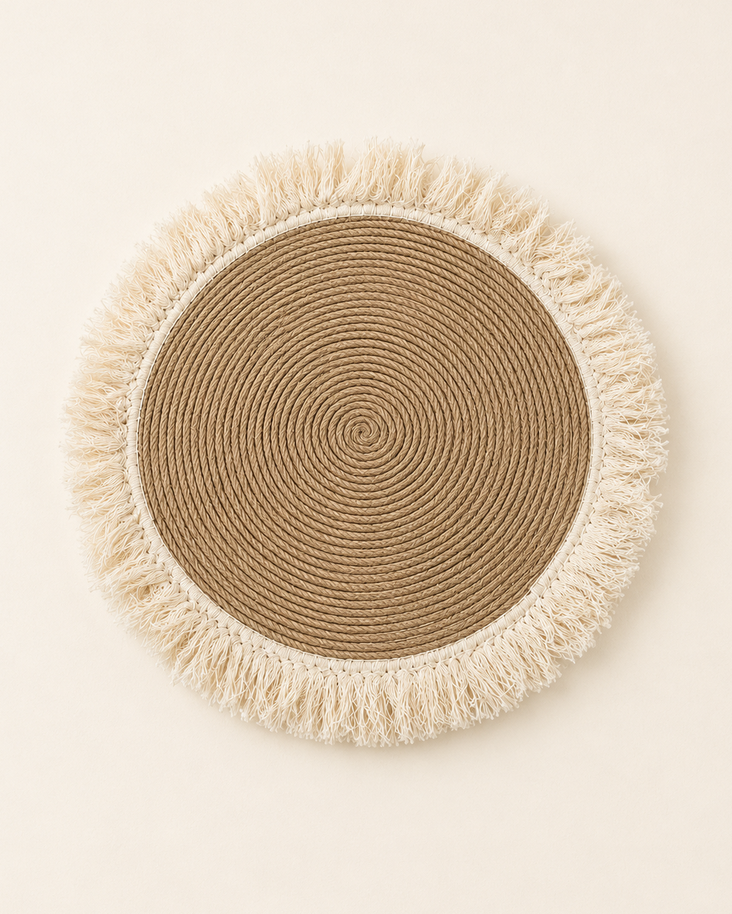 Handmade round jute wall decor with off-white cotton fringe