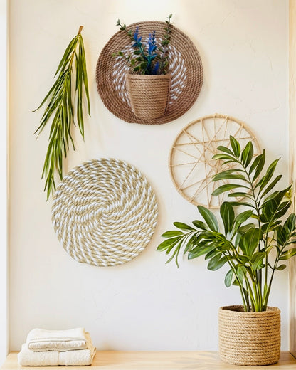 Jute and cotton round wall decor set styled with greenery in a neutral boho interior