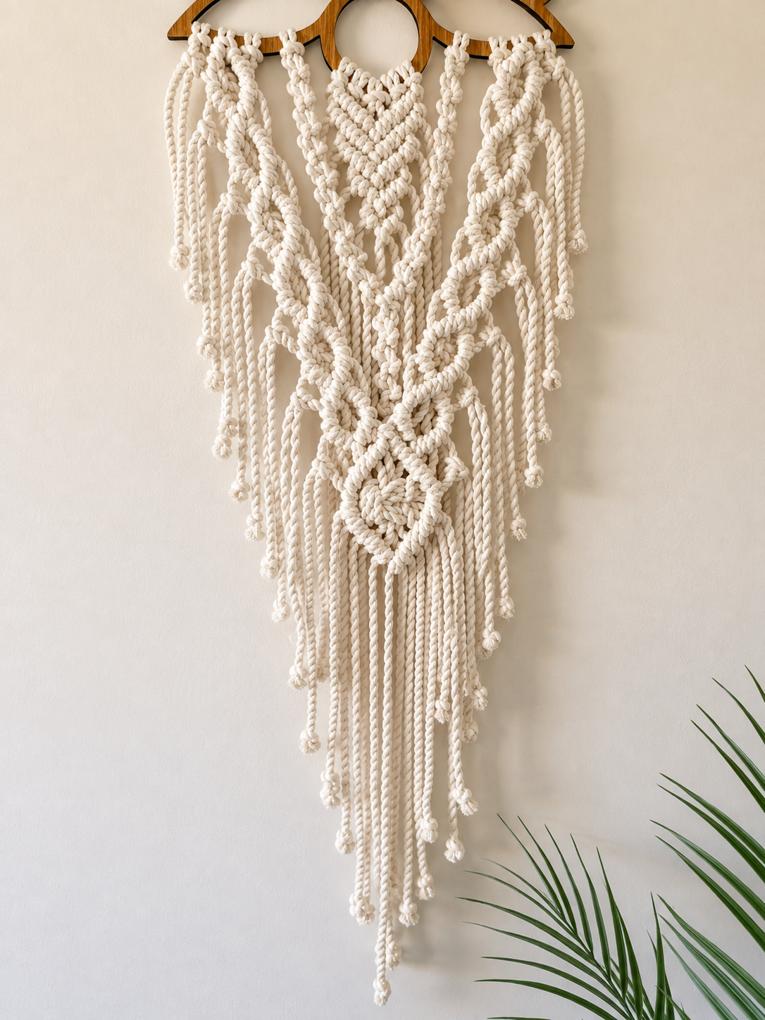 Full view of handmade lotus macrame wall hanging showing intricate knotwork and long fringe.