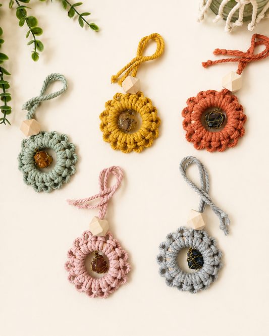 Handmade macrame car charms with natural gemstones and unfinished wooden essential oil diffuser beads in five colour options.