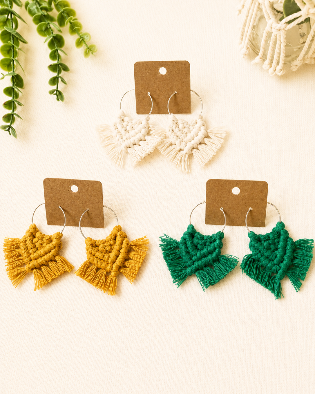 Handmade macrame chevron hoop earrings displayed on eco-friendly kraft jewellery cards.