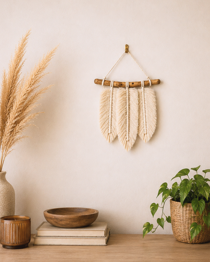Egyptian cotton macrame feather wall hanging styled above a sofa in a boho living room
