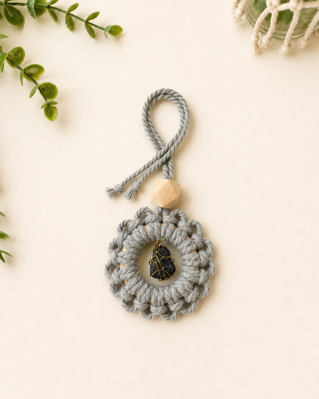 Handmade grey macrame gemstone car charm with a natural unfinished wooden essential oil diffuser bead.