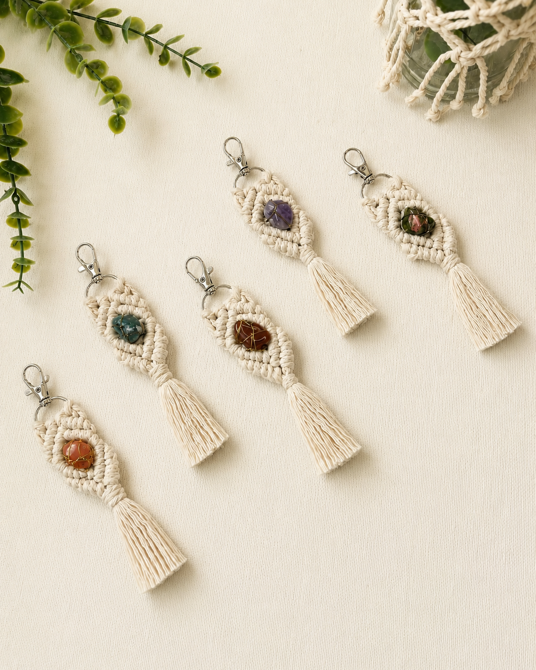 Handmade macrame gemstone keychains in five natural gemstone styles with cotton tassels and silver clasps.