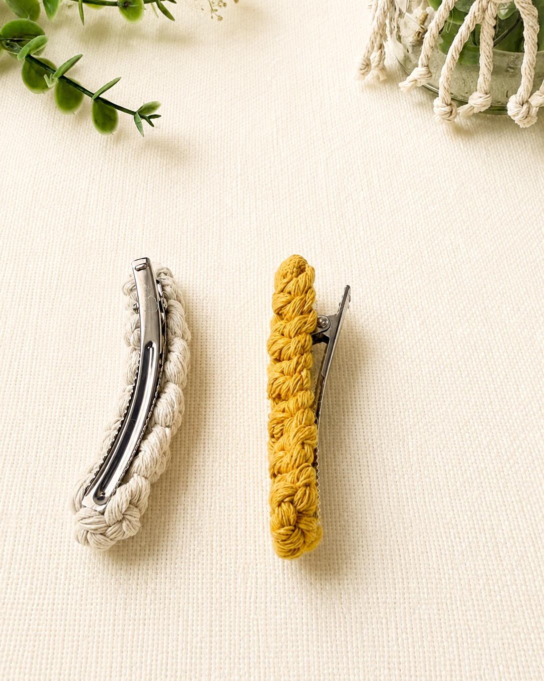 Back view showing the secure metal barrette on a handmade macrame hair clip.