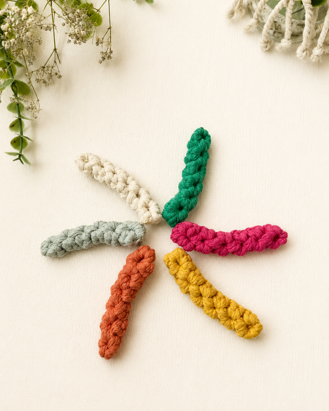 Handmade macrame hair clips available in six colours.