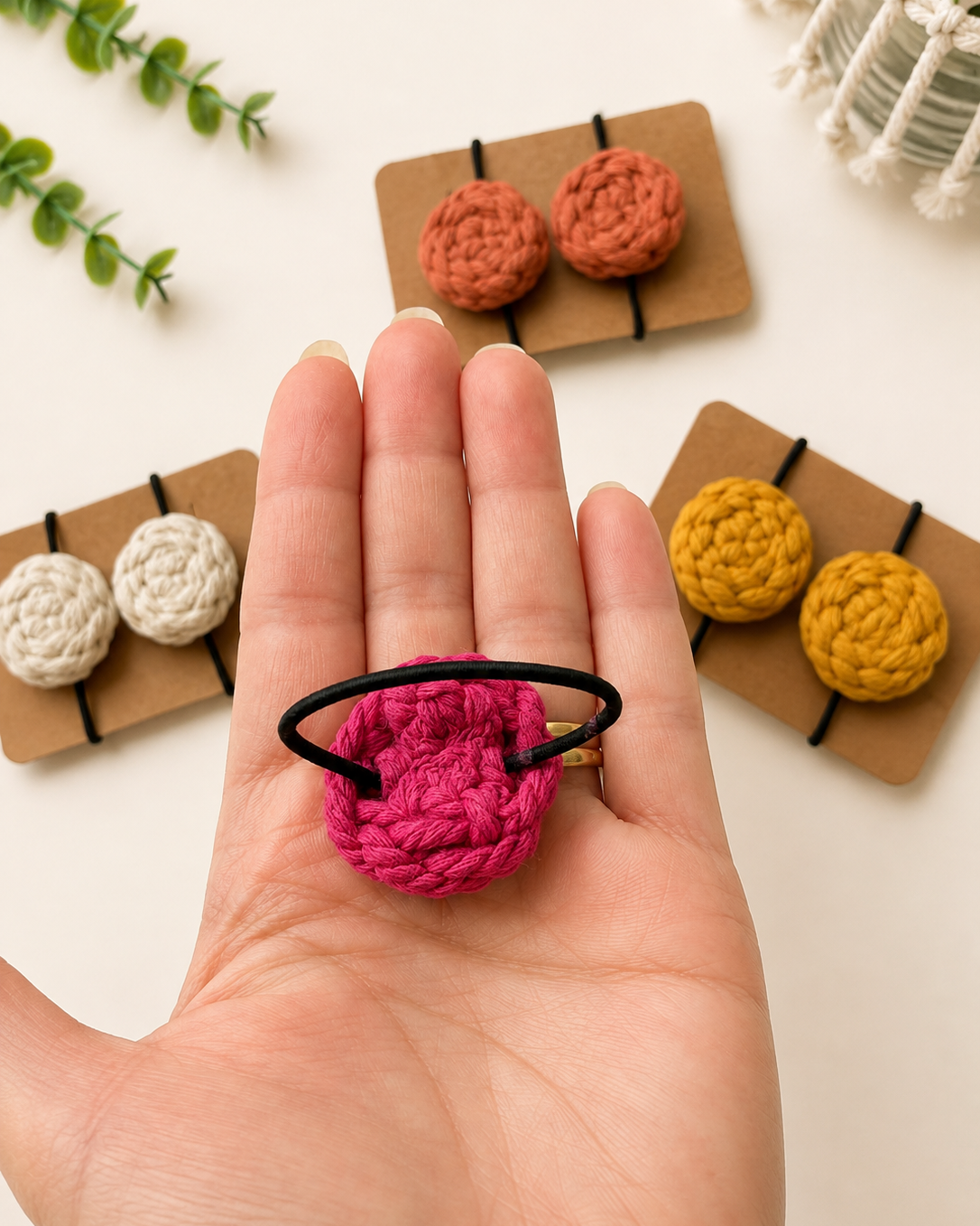 Back view of handmade macrame hair tie showing the secure elastic attachment.