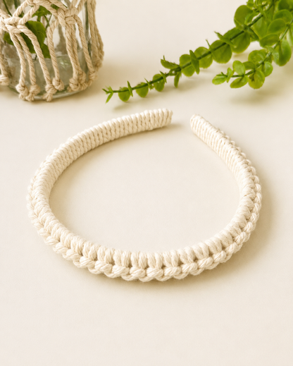 Off-white handmade macramé headband crafted with soft cotton cord.