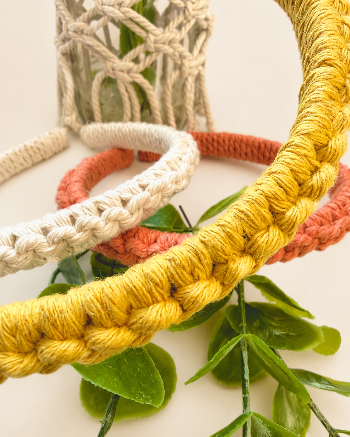 Detailed texture view of handmade cotton macramé headbands showing knot craftsmanship