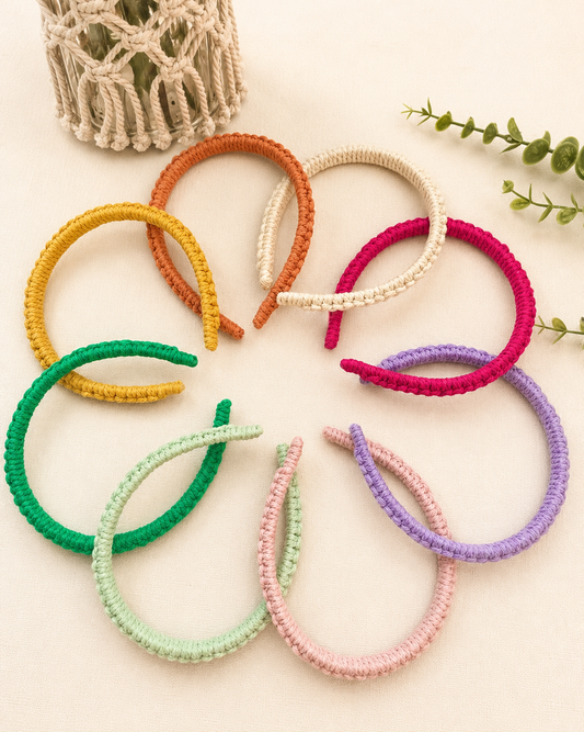 Collection of handmade macramé headbands in mustard, terracotta, off-white, mint green, lilac, baby pink and fuchsia colours