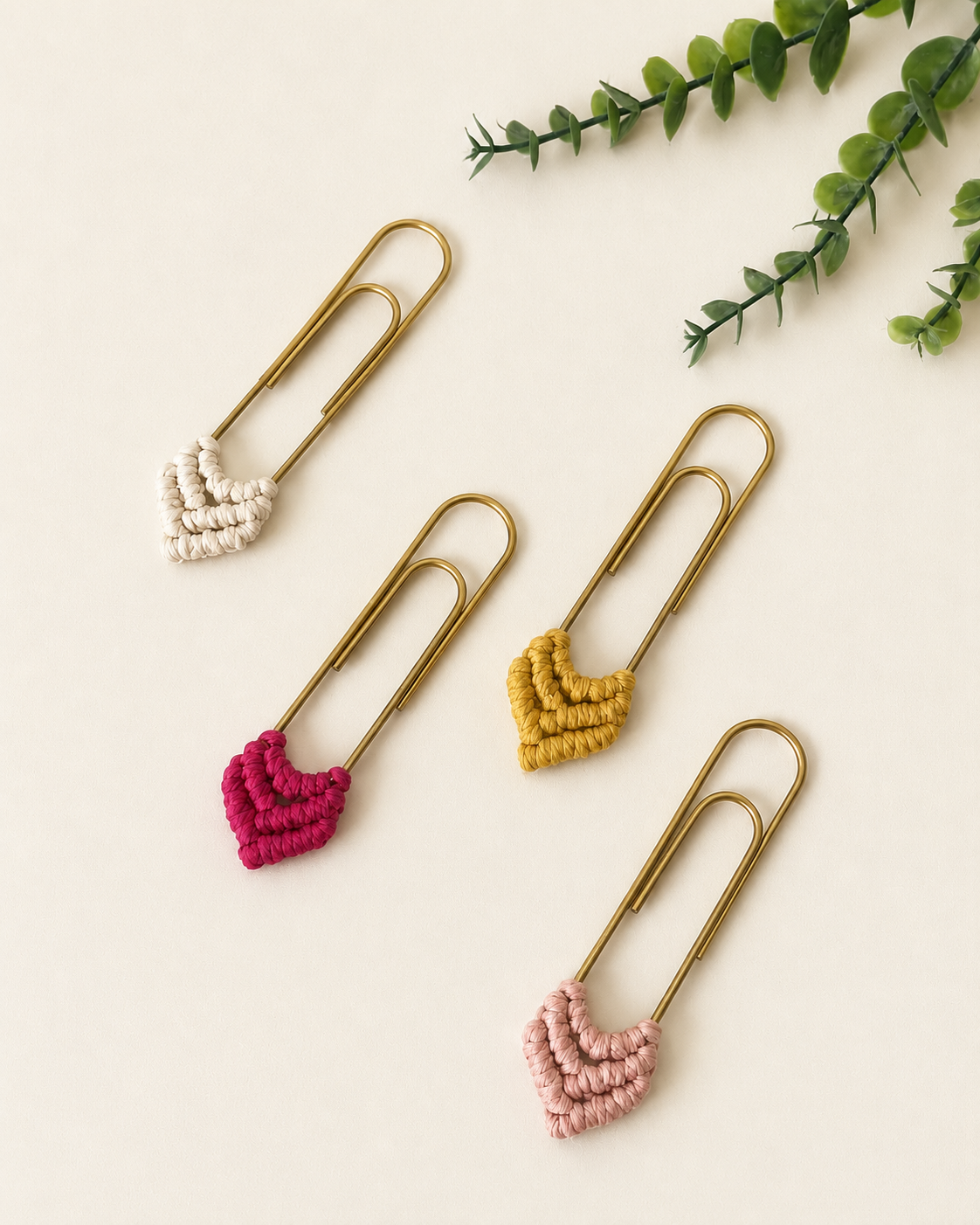 Handmade macrame heart bookmarks with gold paper clips in four colours