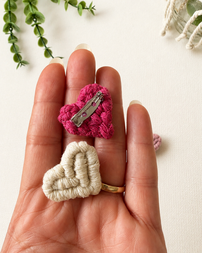 Back of handmade macrame heart brooch showing secure metal pin fastening