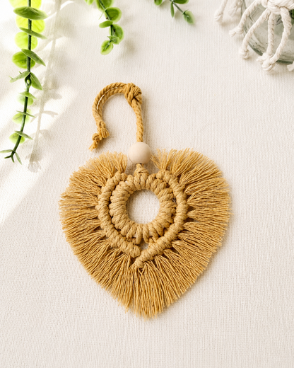 Mustard macrame heart car charm with fringe and wooden bead, handmade boho rear view mirror charm.