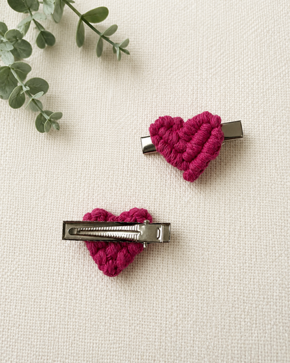 Back view of handmade macrame heart hair clips showing secure silver alligator clip fastening.