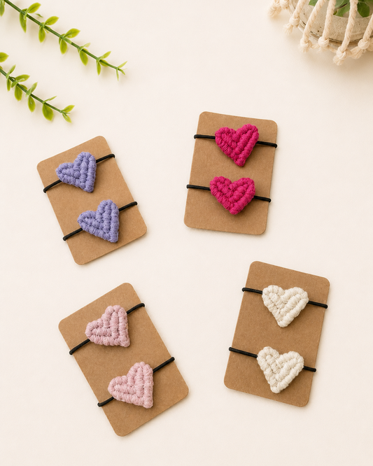 Handmade macrame heart hair ties set in blush pink, hot pink, lilac and off white cotton.