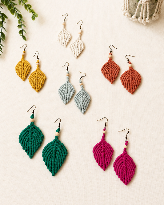 Handmade macrame leaf earrings collection in mustard, off white, terracotta, sage green, emerald green and fuchsia with wooden bead details.