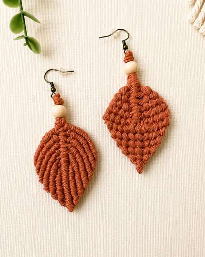 Front and back view of handmade terracotta macrame leaf earrings showing the woven pattern and reverse finish.