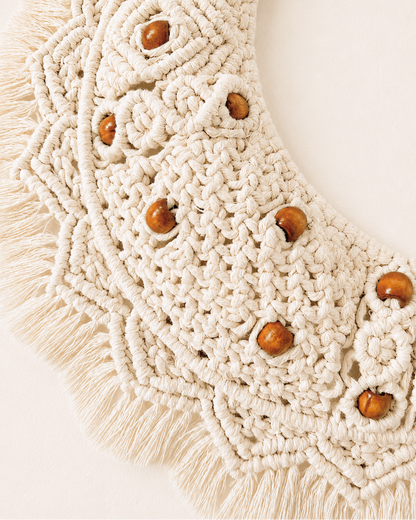 Detailed macrame crescent moon wall decor with brown wooden beads and off-white cotton knots