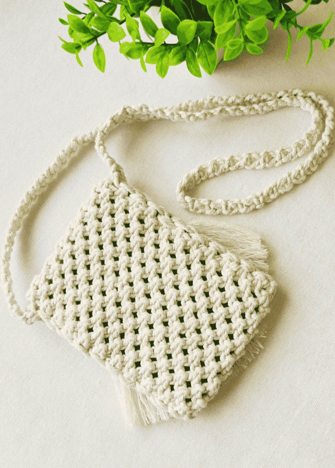 Back view of woven macramé phone bag in off-white cotton – boho textured pattern