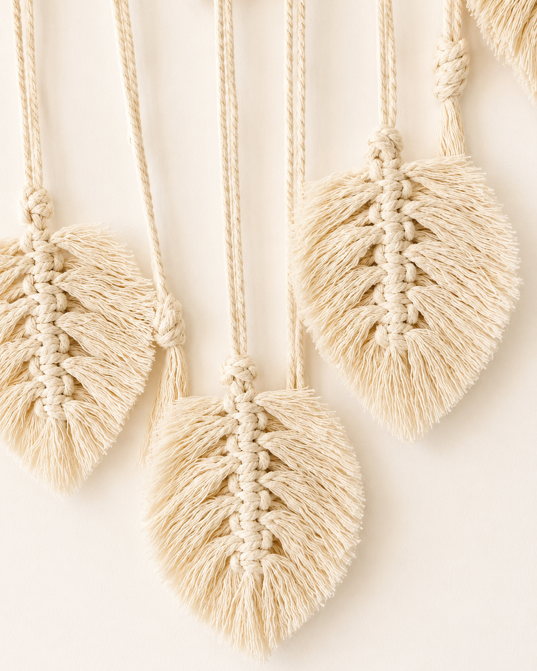 Close-up of handmade cotton macrame leaves on boho photo holder