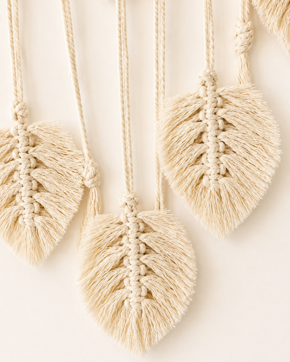 Close-up of handmade cotton macrame leaves on boho photo holder