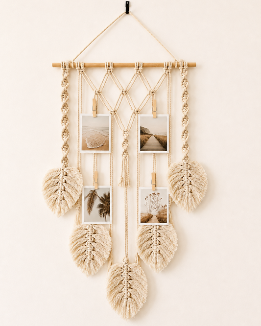 Handmade macrame photo holder with five leaves and wooden pegs displaying photos