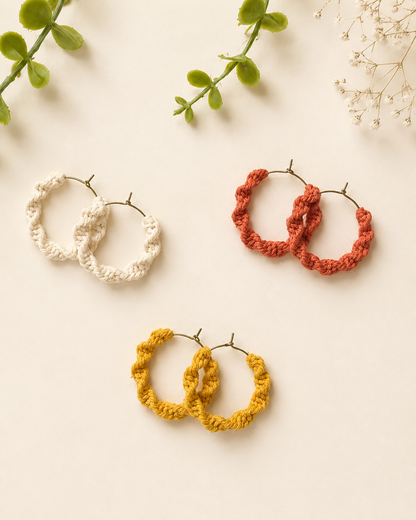 Handmade macramé spiral hoop earrings in off-white, mustard yellow and terracotta cotton cord.
