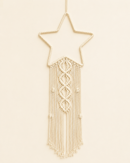 Macrame star wall hanging handmade with cotton cord and decorative fringe in off white boho nursery decor style
