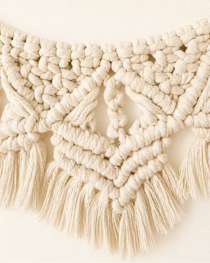 Close-up of intricate Egyptian cotton knots and fringe on macrame wall hanging