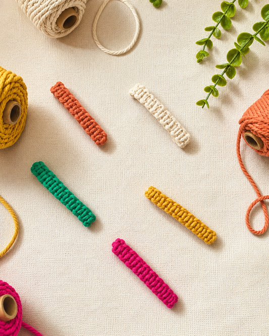 Handmade macramé hair clips in five colours including off-white, mustard, terracotta, green and fuchsia