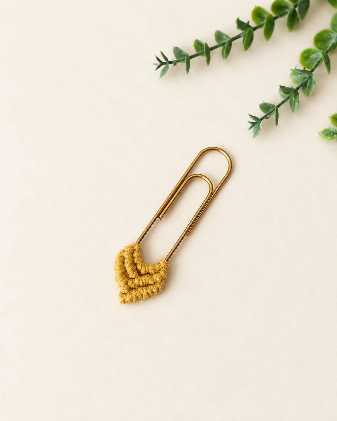 Mustard handmade macrame heart bookmark with gold paper clip